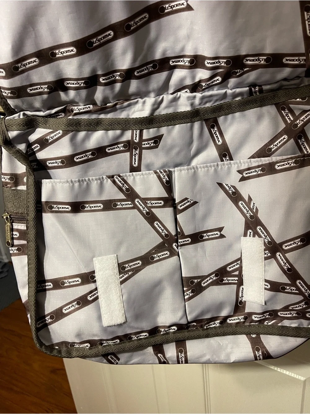 Lesportsac White and Brown Patterned Messenger Bag